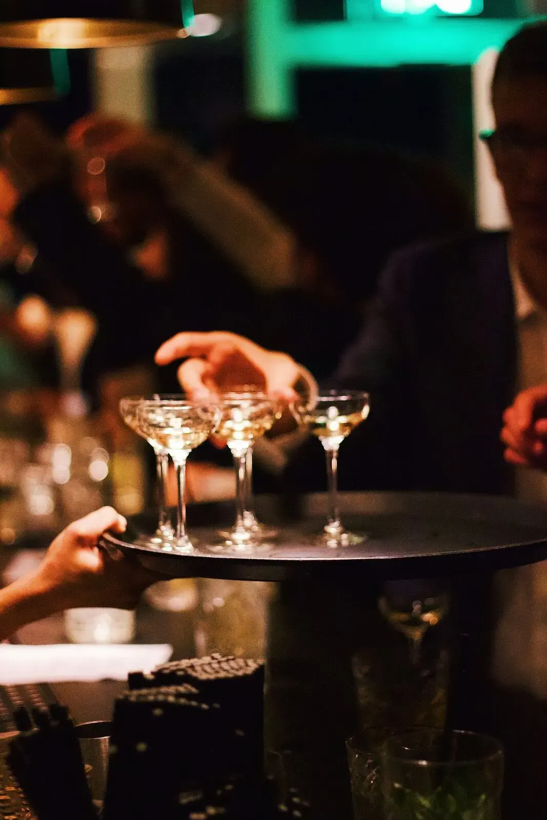 Coupe glasses prepared on a tray for service