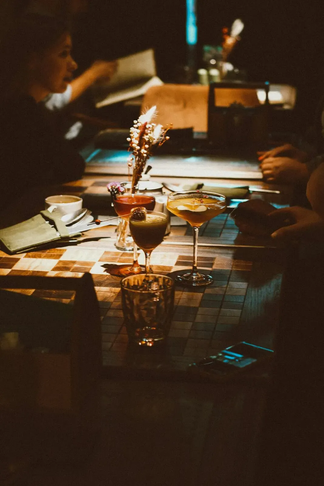 A dinner table set with glassware