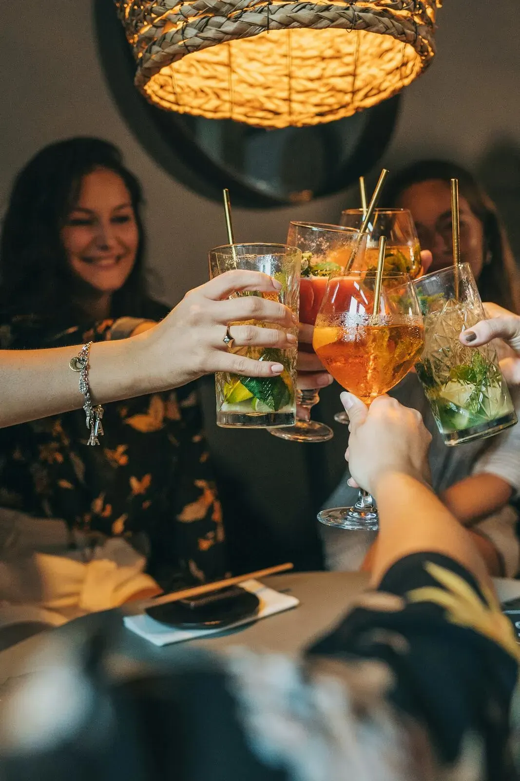 Guests raising glasses in a toast at an evening celebration