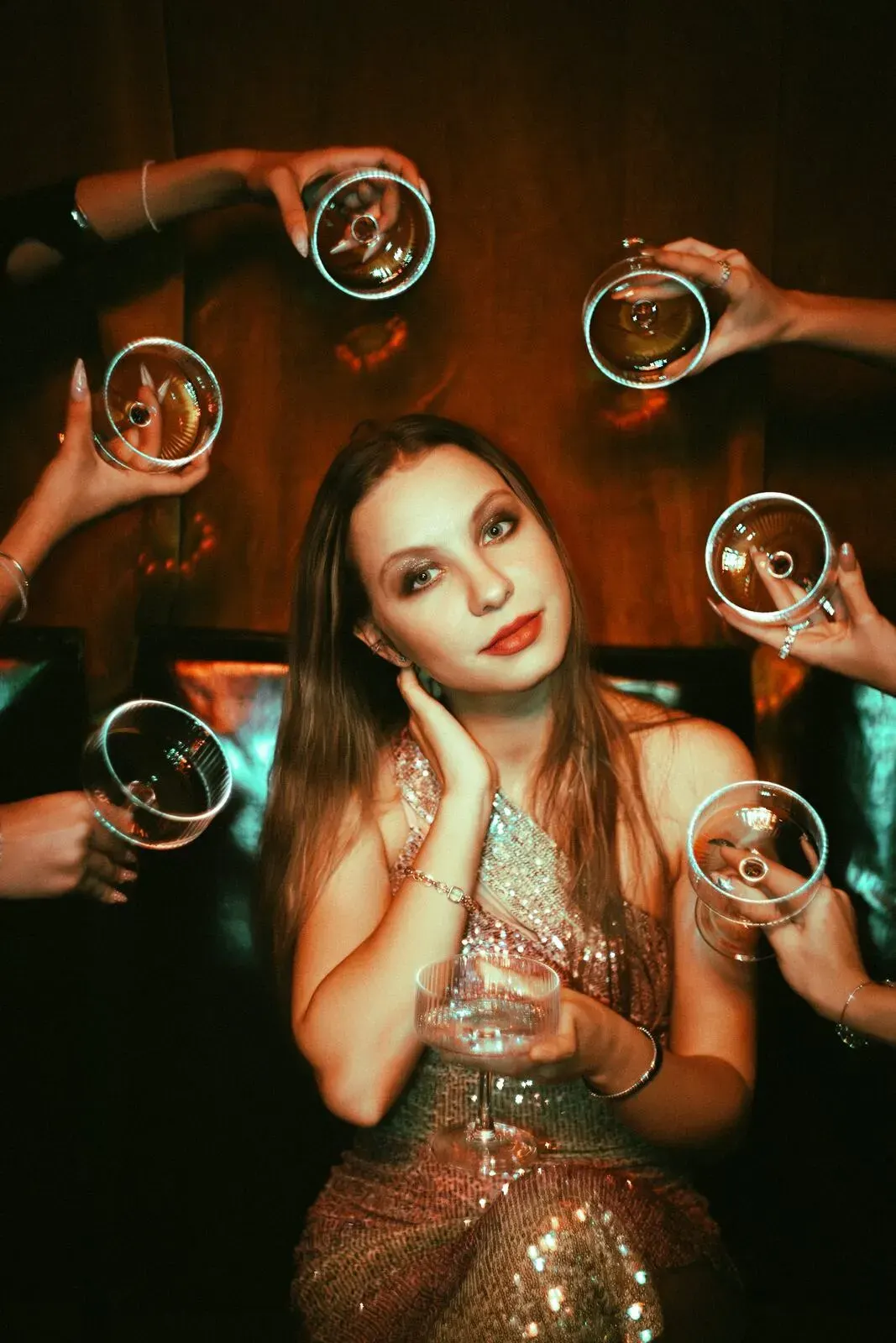 Guests raising coupes at an evening celebration