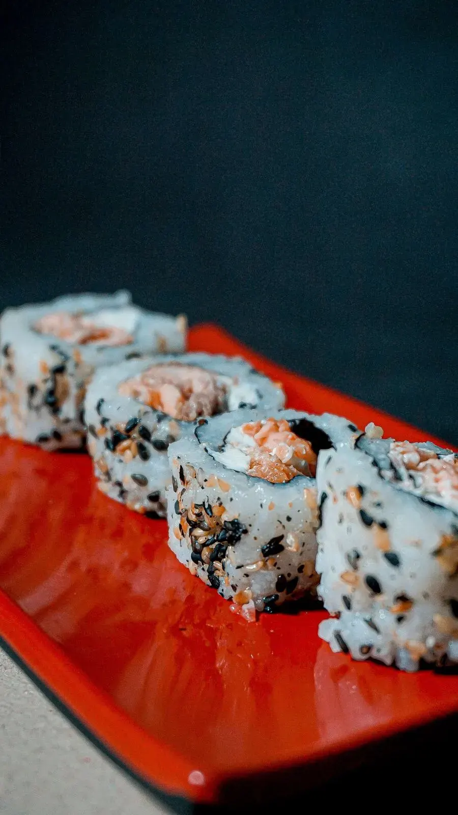 Sushi rolls on a red plate